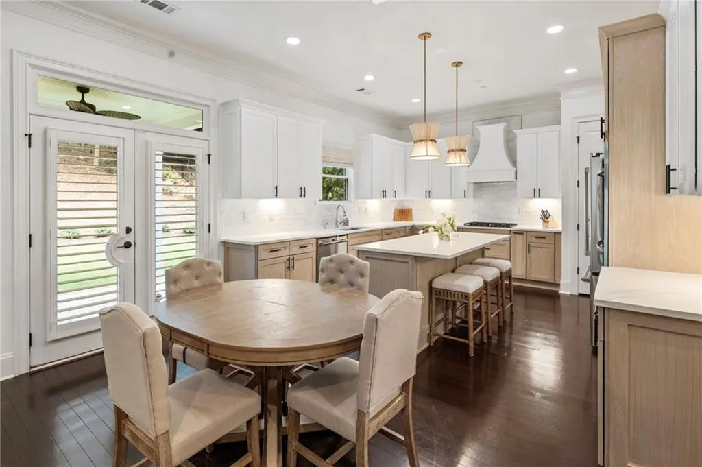 Dining space featuring ornamental molding, dark wood-style floors, recessed lighting, and french doors