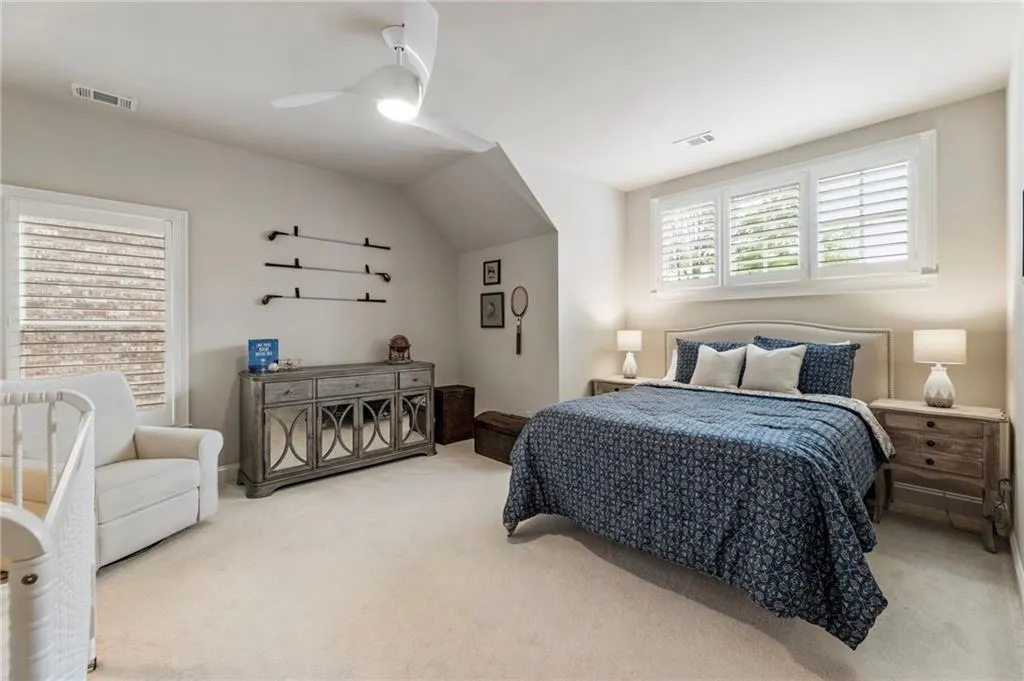 Bedroom with carpet floors and ceiling fan