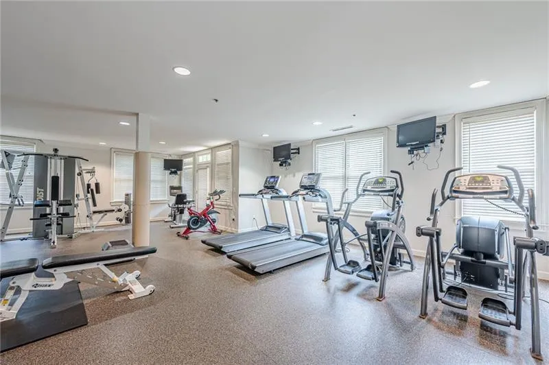 Workout area featuring recessed lighting
