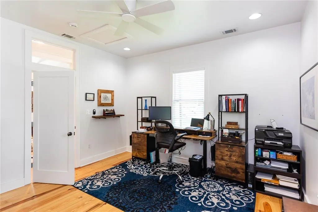 Notice the oversized door with glass transom.