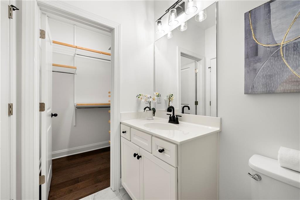 2nd Bedroom Bathroom with walk-in closet with custom closet system