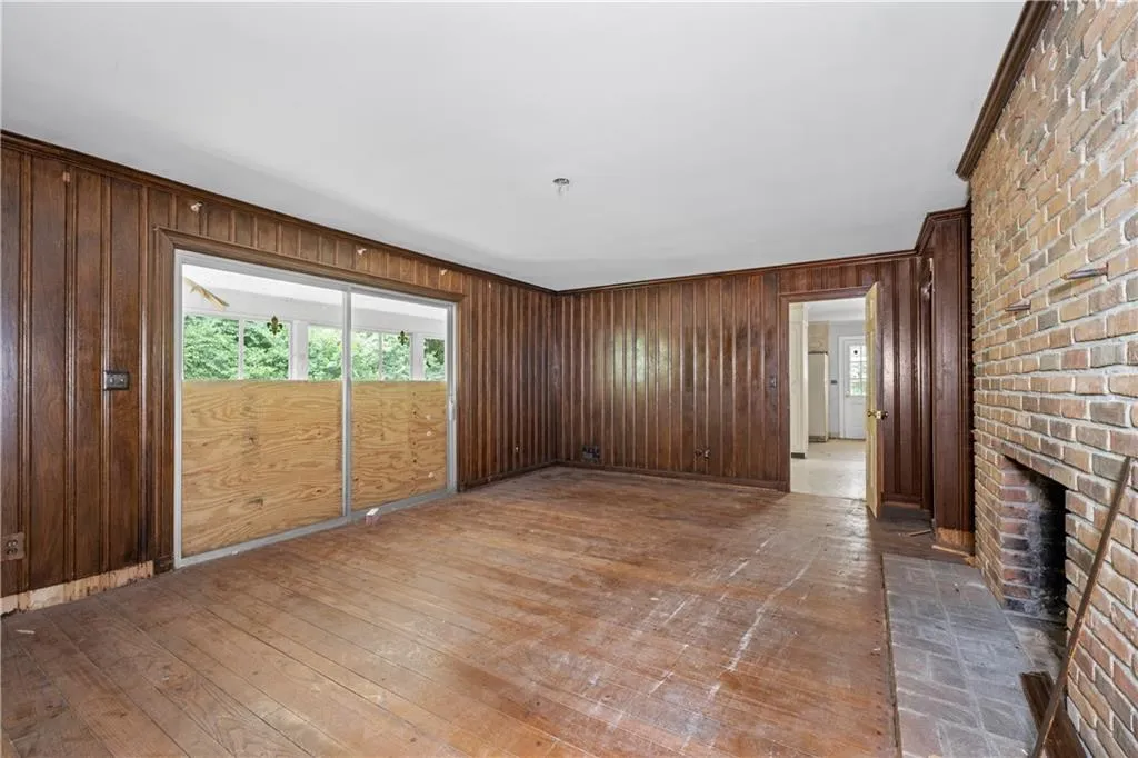 Opens to glass sliding doors and screened-in porch