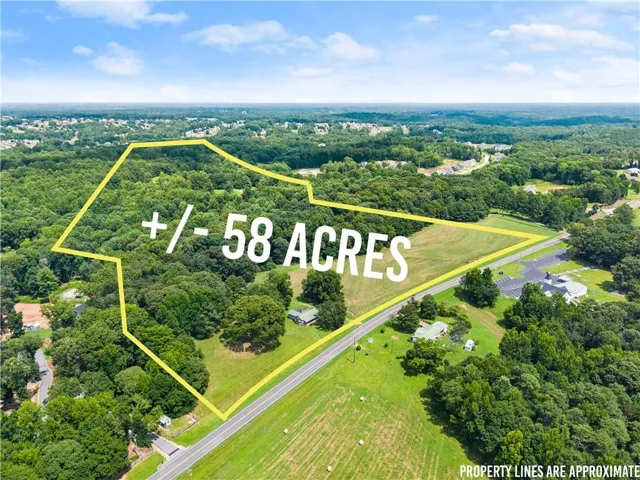 Approximately 58-acre parcel offering expansive cleared and wooded acreage with road frontage