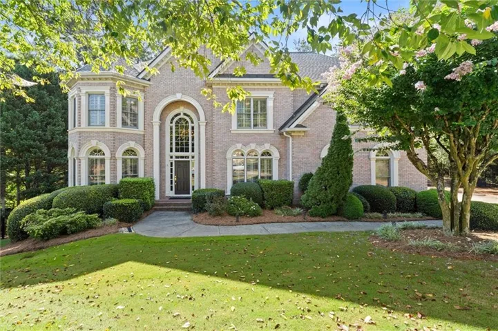Stately four-sided brick home situated on a quiet cul-de-sac in guard-gated St. Marlo Country Club.