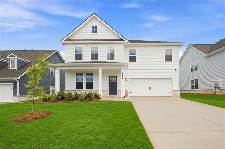 Two-story residence featuring white siding and a prominent front gable