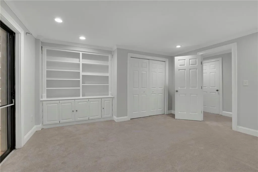 Terrace Level Bedroom with Built In Bookshelves - Access to Paved Back Patio