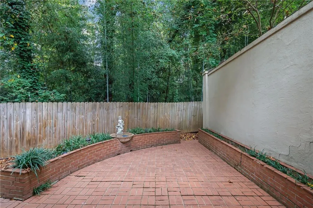 Great Courtyard Terrace with Paved Bricks, Nice Landscaping and a Tranquil Fountain