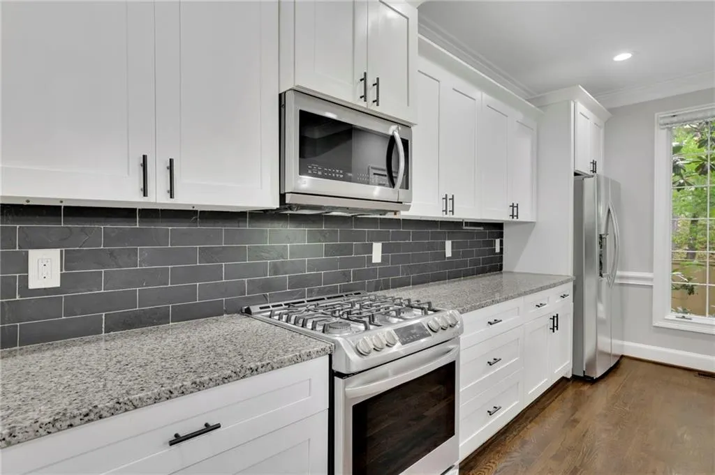 Chef's Kitchen with Gourmet Island, New Pendant Lighting, Stainless Steel Appliances