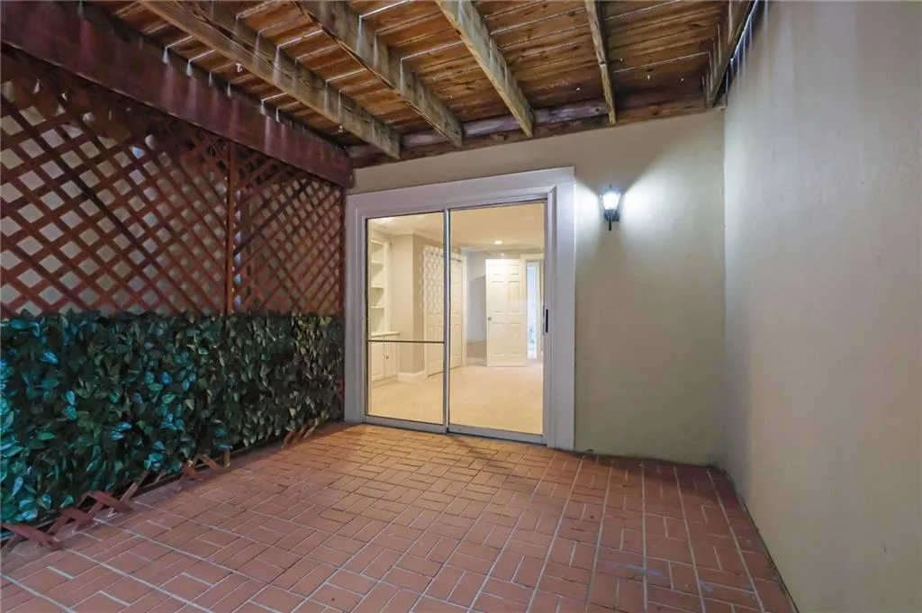 Great Courtyard Terrace with Paved Bricks, Nice Landscaping and a Tranquil Fountain