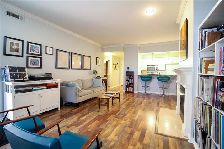 Living area with view to breakfast bar and kitchen.