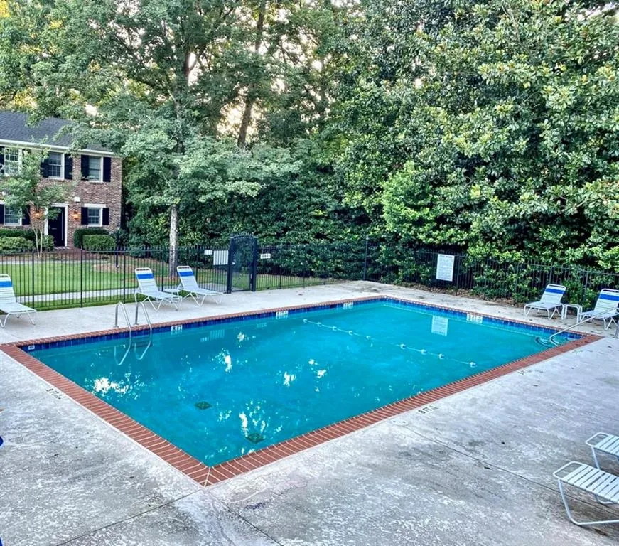 Community pool featuring a patio area