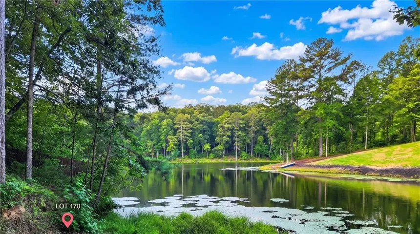 Gentle slop to waterfront lot offering direct access to Lake