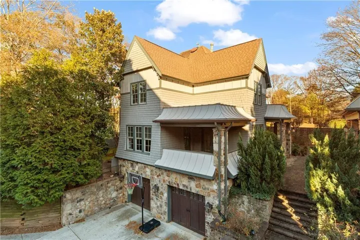 Stone and shingle exterior with a gabled roof
