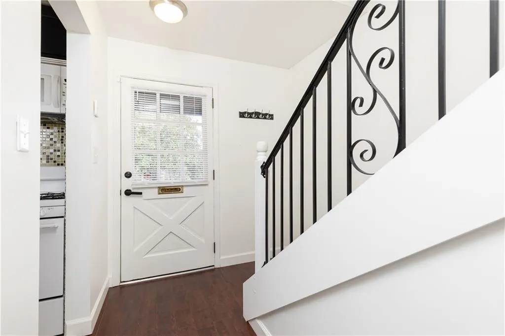 View towards front door; kitchen on the left.