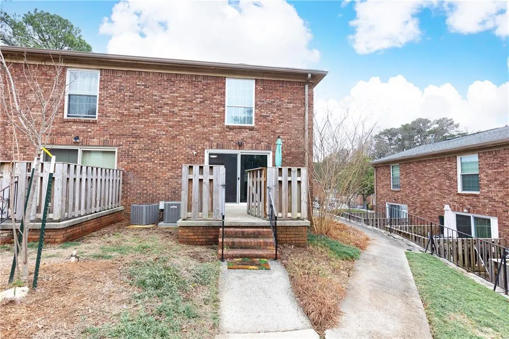 Rear of home features private patio ideal for entertaining or relaxing.