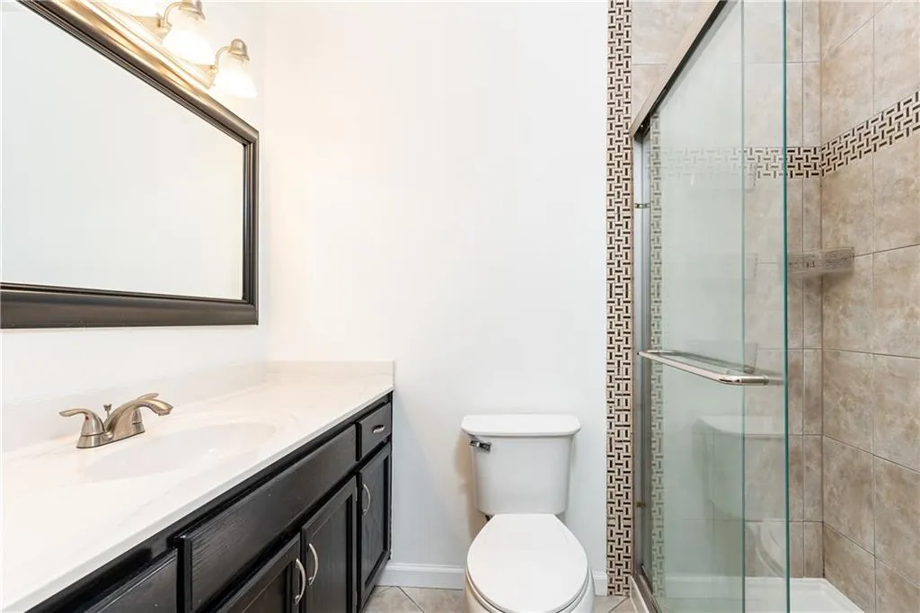 Full bathroom upstairs redone in 2020 featuring tiled shower.