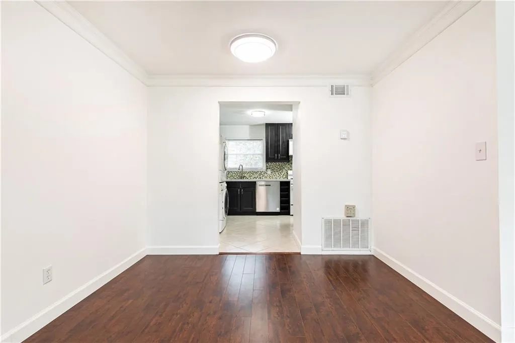 Open-concept dining room with view into the kitchen.
