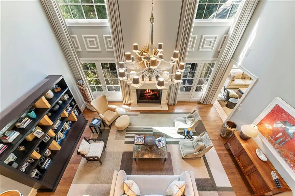 A view from the upstairs gallery as we move from the primary suite to three additional upstairs bedrooms.