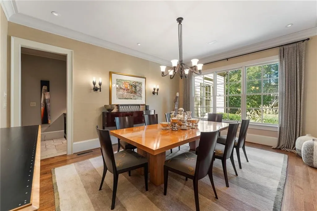 The dining room connects conveniently to the kitchen through an elegant butler's pantry for serving convenience.