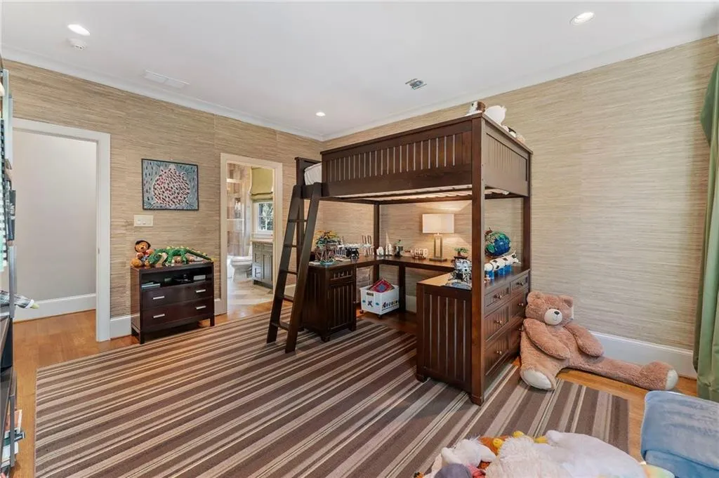 One of two corner bedrooms with ensuite bath and walk-in closet.