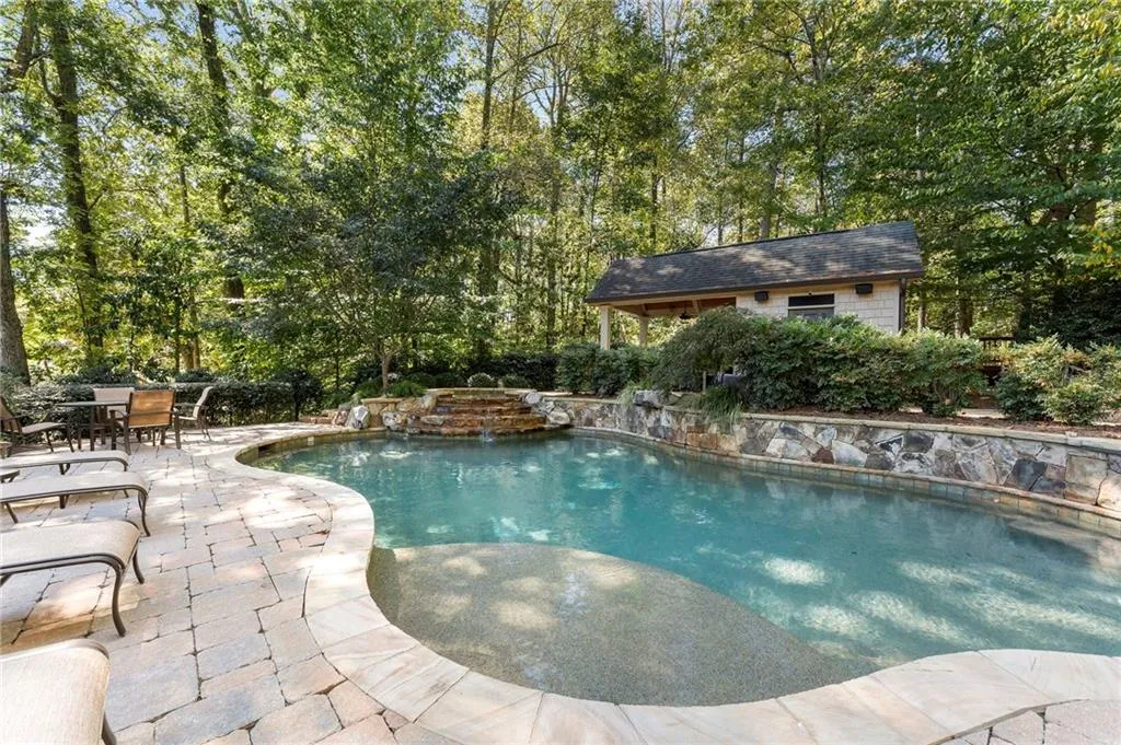 The beautiful pool fits so nicely into nature complete with its waterfall feature.