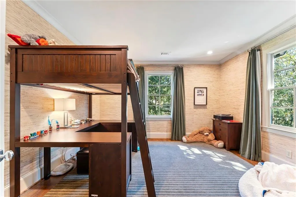 One of two corner bedrooms with ensuite bath and walk-in closet.