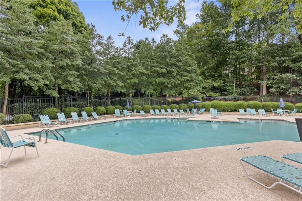 Community pool featuring a patio