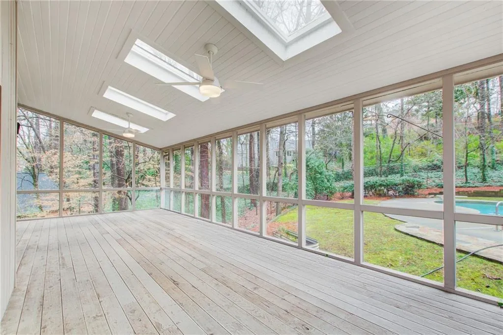 Screened in porch overlooking your backyard with a pool