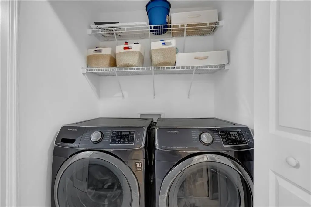 Washroom featuring independent washer and dryer and hookup for a washing machine
