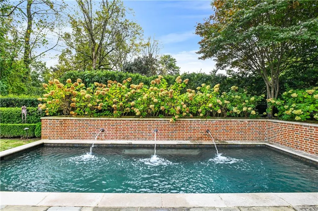 Heated swimming pool with three wifi connected fountains built in