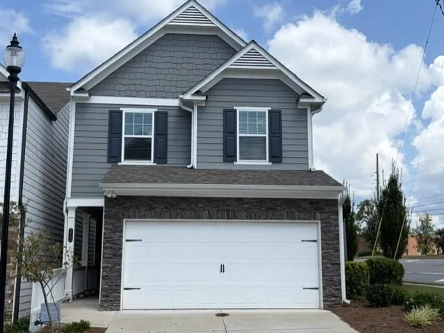 Two-story exterior with horizontal siding and shake accents