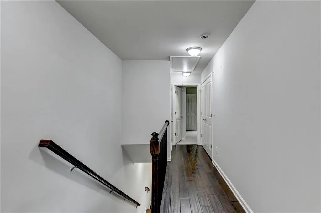 Gleaming hardwoods extend to the upper level