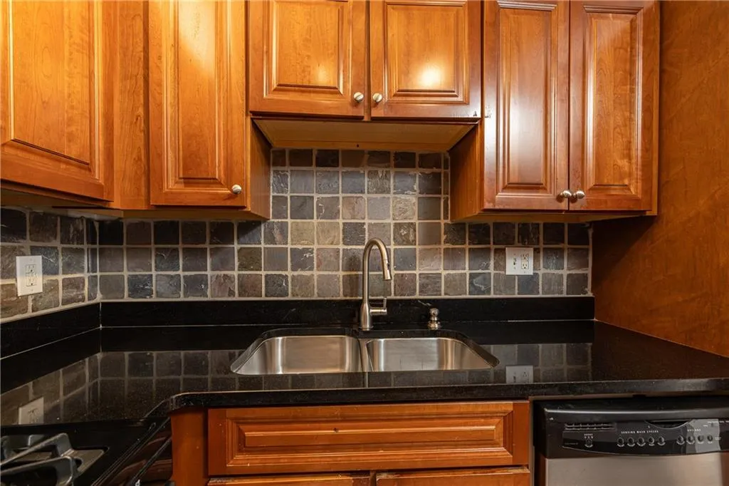 Tile backsplash and ample cabinetry provide both style and storage.