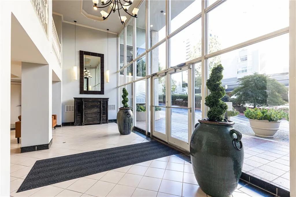 Welcoming Park Lane lobby with dramatic floor-to-ceiling windows.