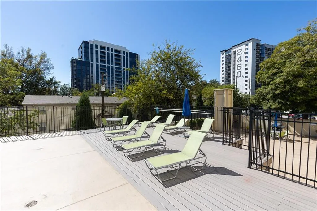 Poolside sundeck with plenty of space to relax outdoors.