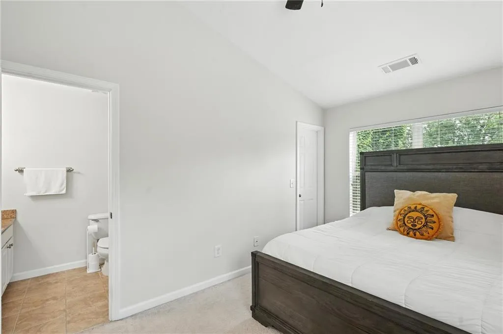 Bedroom featuring lofted ceiling and a ceiling fan