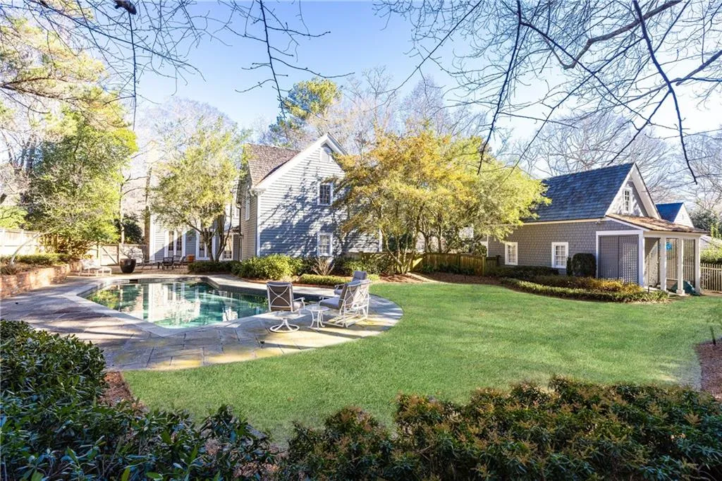 Flat backyard behind pool