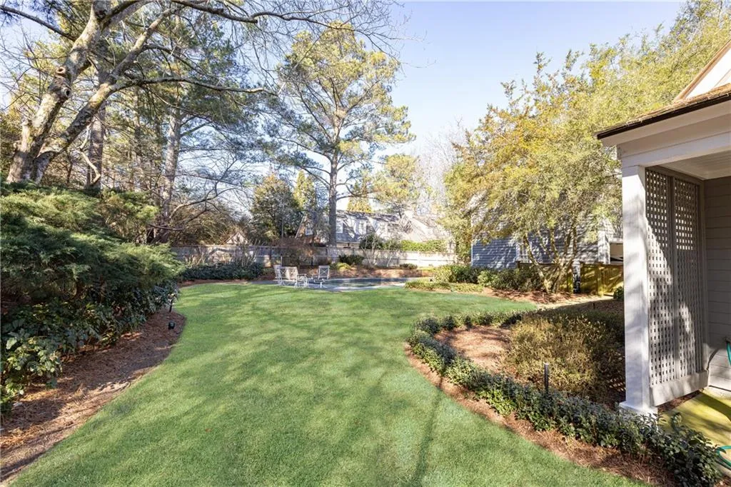 Flat backyard behind pool