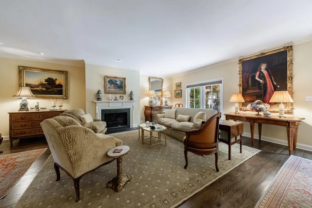view from dining area to living area with gas fireplace