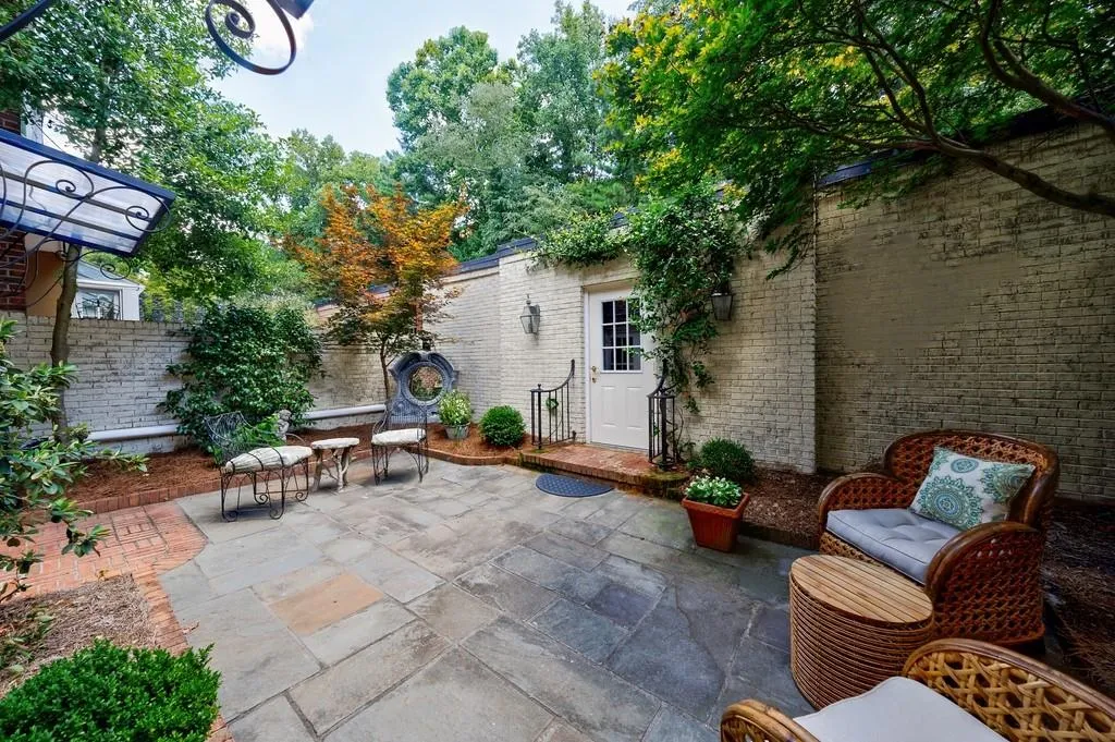 Charming courtyard with garden. The brick walls have been recently whitewashed to brighten the garden room.
