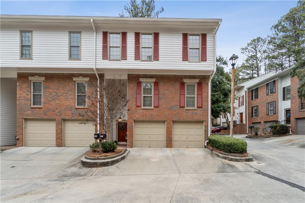 View of property with a garage