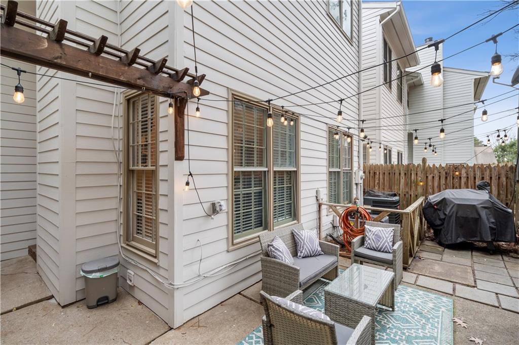 View of patio featuring outdoor lounge area and area for grilling