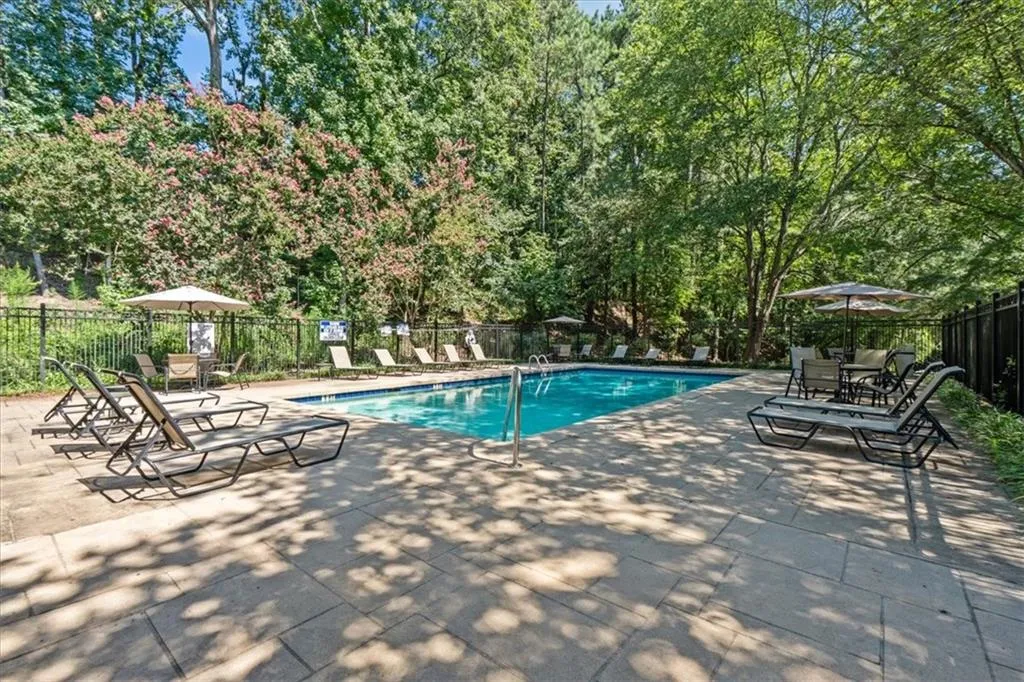Community pool featuring a patio
