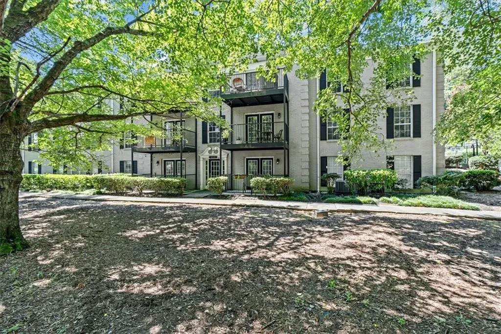 View of front facade with a balcony and french doors
