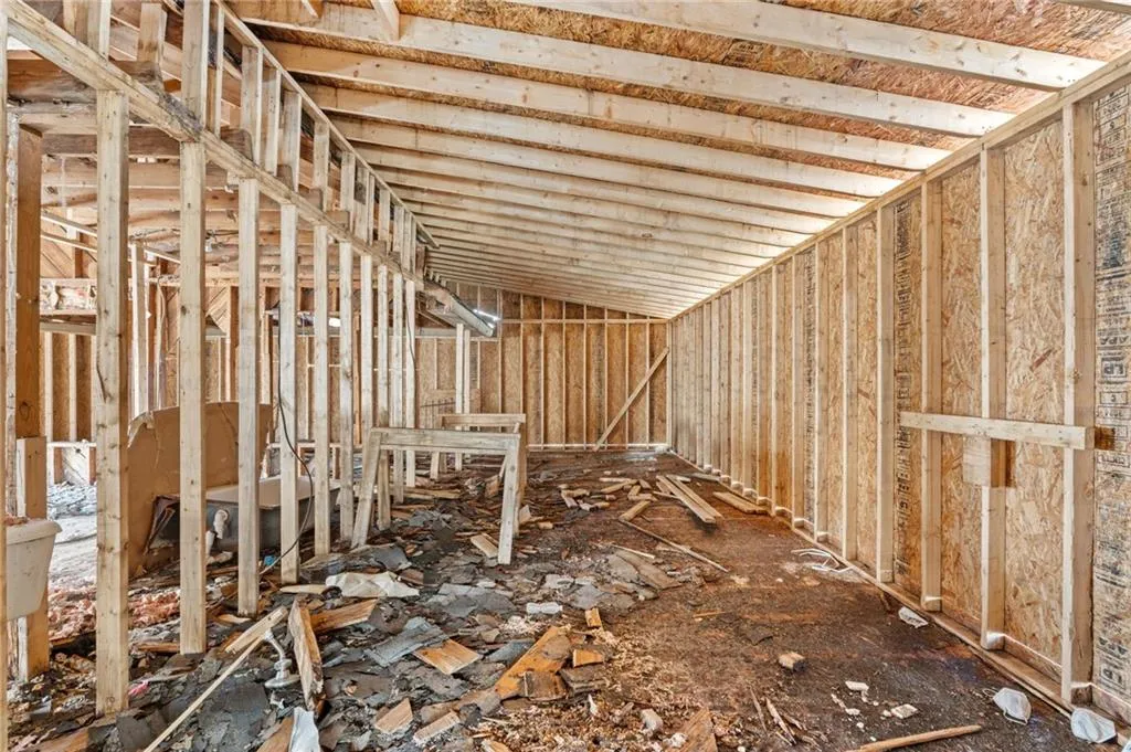 Miscellaneous room featuring lofted ceiling