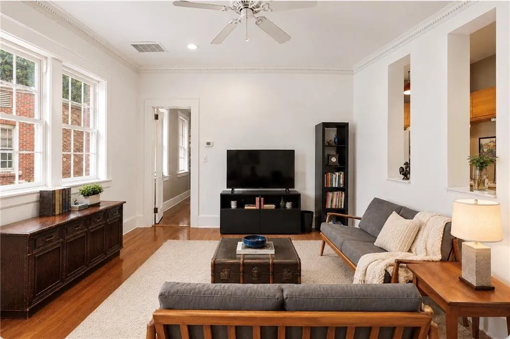 A pleasant space to unwind with abundant windows drawing in natural light. Staging digitally edited.