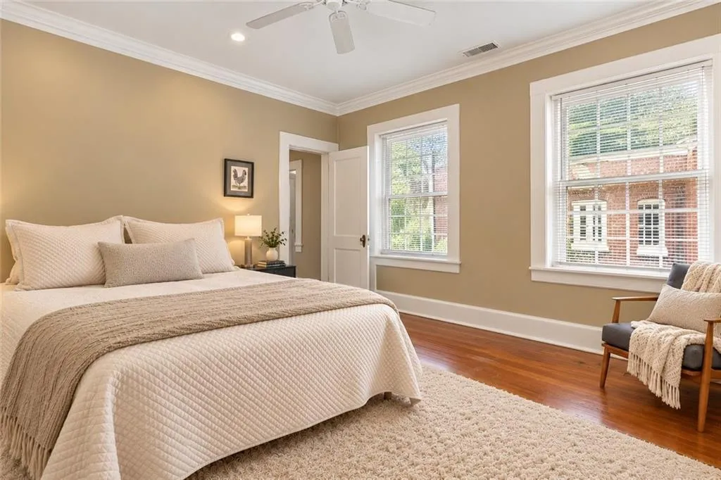 Gleaming hardwood floors and generous windows drawing in abundant natural llight. A welcome space to begin and end your day! Staging digitally edited.