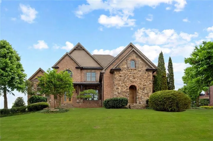 Brick and stone exterior with multiple gables