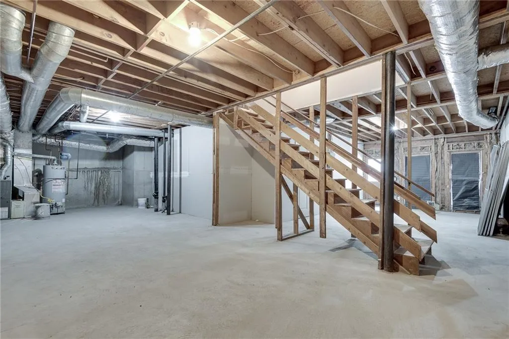 Basement featuring water heater