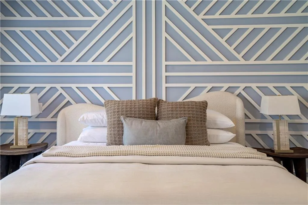 Bedroom with a decorative wall